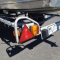 1035933-38 Buster aluminum boat on trailer and 4-stroke engine