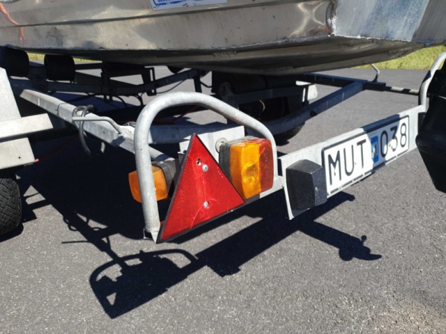 1035933-38 Buster aluminum boat on trailer and 4-stroke engine