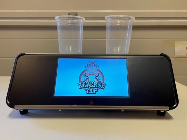 1233498-2 Ölmaskin Reverse Tap med tillhörande mugg - 100 st