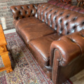 1250472-7 Chesterfield green and brown armchairs including small table