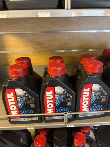 1286460-12 Display stand with oils and maintenance products - Motul
