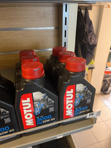 1286460-11 Display stand with oils and maintenance products - Motul