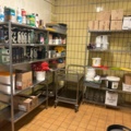 1315889-1 Warehouse shelves with contents, trolley, stainless steel bench, glass