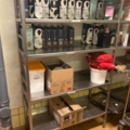 1315889-5 Warehouse shelves with contents, trolley, stainless steel bench, glass