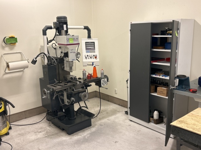 Universal milling machine including cabinet with tools and accessories ...