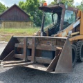 1382930-1 Case 1840 Skid Steer Loader with Two Buckets and Forks