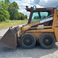 1382930-2 Case 1840 Skid Steer Loader with Two Buckets and Forks