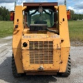 1382930-4 Case 1840 Skid Steer Loader with Two Buckets and Forks