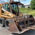 1382930-8 Case 1840 Skid Steer Loader with Two Buckets and Forks