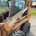1382930-23 Case 1840 Skid Steer Loader with Two Buckets and Forks