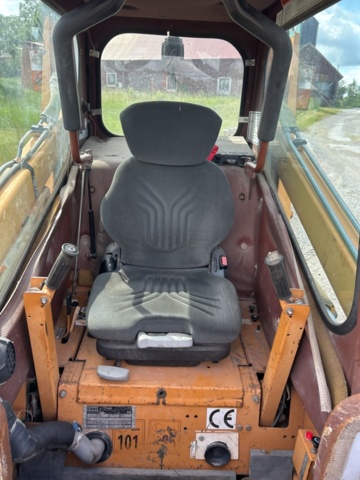 1382930-9 Case 1840 Skid Steer Loader with Two Buckets and Forks