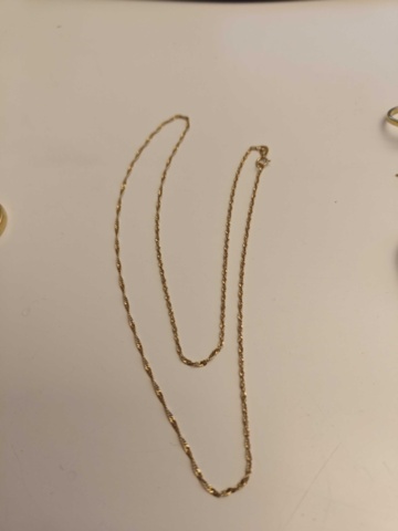 1130290-10 Parti med smycken i guld