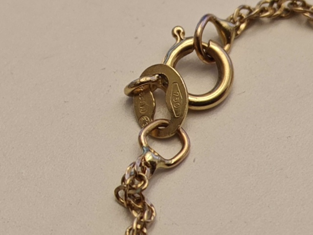 1130290-11 Parti med smycken i guld