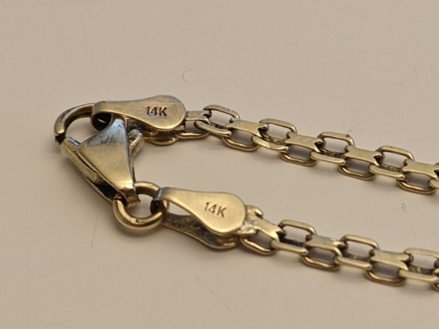 1130290-19 Parti med smycken i guld