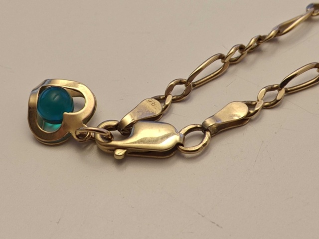 1130290-21 Parti med smycken i guld