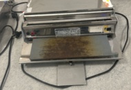 1429965 Manuell bordsmonterad plastfilmsförpackare