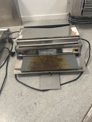 1429965-1 Manuell bordsmonterad plastfilmsförpackare