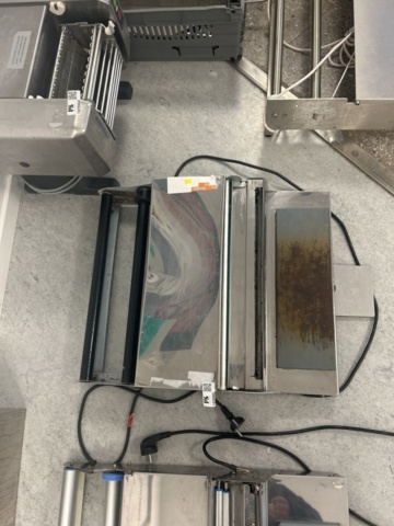 1429965-2 Manuell bordsmonterad plastfilmsförpackare