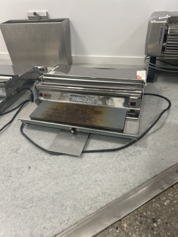 1429965-4 Manuell bordsmonterad plastfilmsförpackare