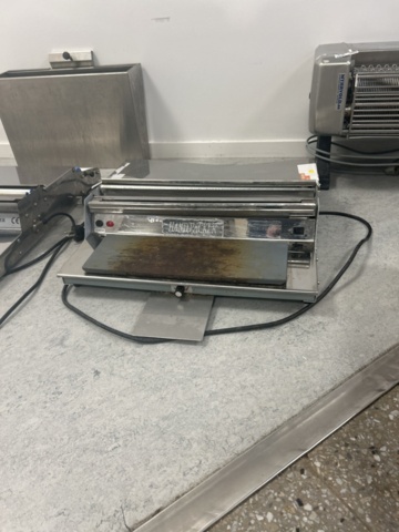 1429965-5 Manuell bordsmonterad plastfilmsförpackare