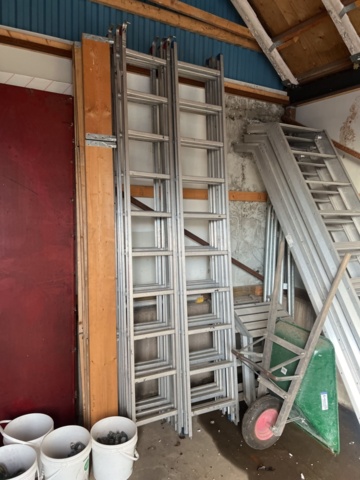 1431508-11 Various ladders, aluminum scaffolding steps, wheelbarrows, etc.