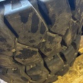 1321216-3 Truck tire with rim 27x10-12