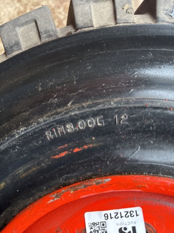 1321216-4 Truck tire with rim 27x10-12