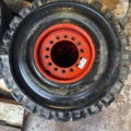 1321216-1 Truck tire with rim 27x10-12