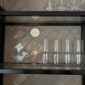 1372732-5 Wall-mounted glass shelf with carafes, glasses and cups