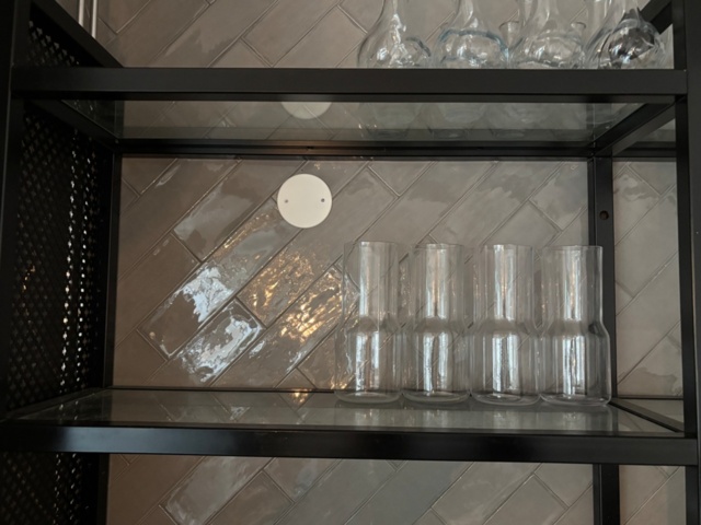 1372732-5 Wall-mounted glass shelf with carafes, glasses and cups