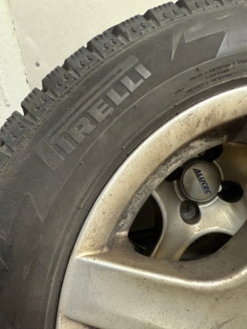 1352446-7 4 Pirelli studded tires on aluminum rims 175/65 4-hole