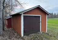 1372834 Förrådsbyggnad med slagport