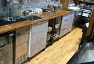 1457457 Workbench with two sinks, cabinets and shelves