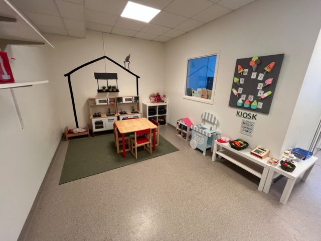 1424075-1 Playroom with furniture and toys - table, chairs, play kitchen, children's armchairs, storage