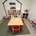 1424075-9 Playroom with furniture and toys - table, chairs, play kitchen, children's armchairs, storage