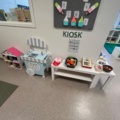1424075-10 Playroom with furniture and toys - table, chairs, play kitchen, children's armchairs, storage