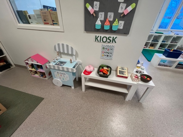 1424075-10 Playroom with furniture and toys - table, chairs, play kitchen, children's armchairs, storage