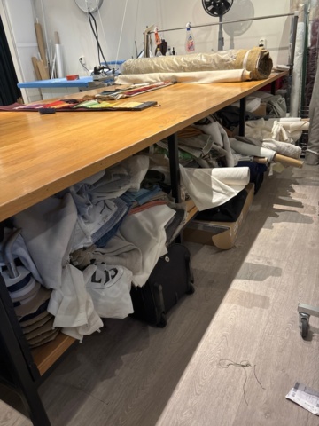 1411005-2 Large work table with various textiles