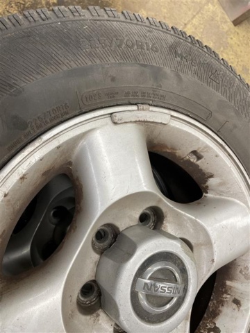 1471221-8 Mixed tires on rims