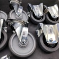 1483181-3 Castors, 10 pcs – grey rubber wheels, swivel, flat mount