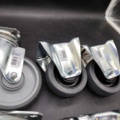 1483181-5 Castors, 10 pcs – grey rubber wheels, swivel, flat mount