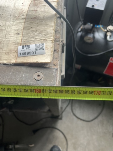 1469591-8 Workshop bench with mixed hand and power tools.