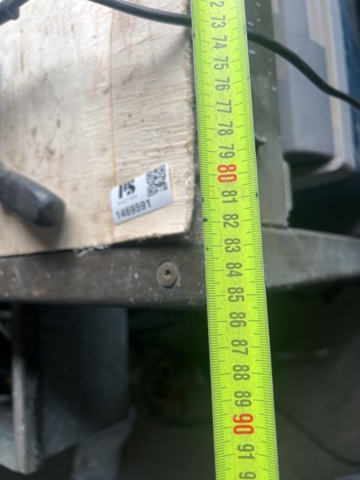 1469591-9 Workshop bench with mixed hand and power tools.