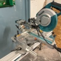 1469100-2 Crosscut and miter saw on mobile saw table - Makita LS0815FL / WST06