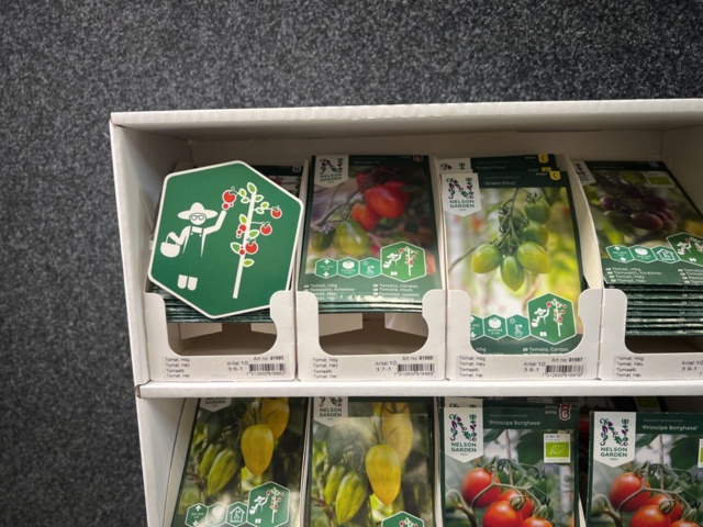 1493426-3 Retail rack with Nelson Garden seed bags of tomato seeds