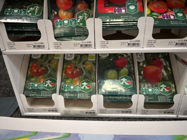 1493426-11 Retail rack with Nelson Garden seed bags of tomato seeds